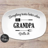 everything tastes better when grandpa grills it serving platter on white with fork and spatula